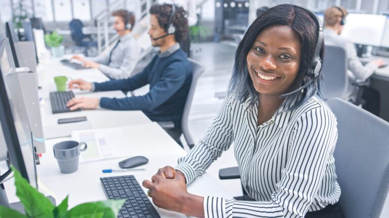 Booking agent wearing a headset in a call centre