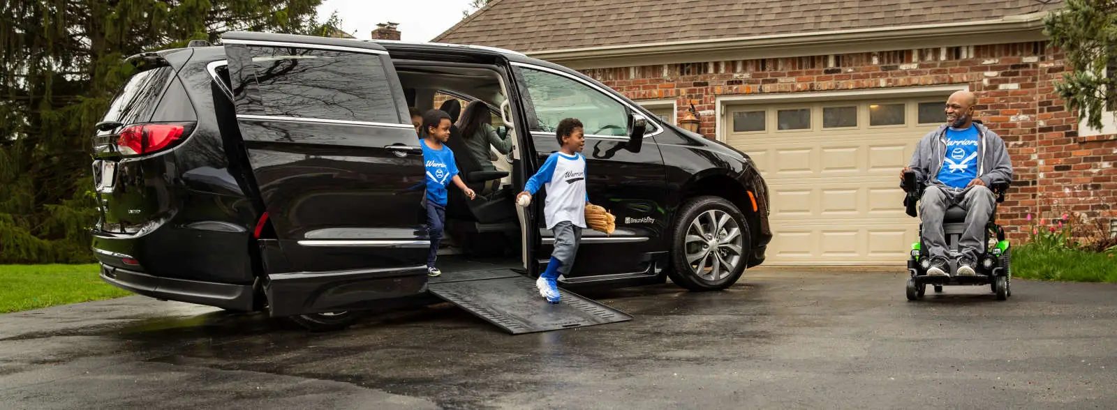 Wheelchair-accessible van with its side ramp lowered